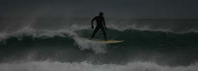 Surfer at Strathy Beach